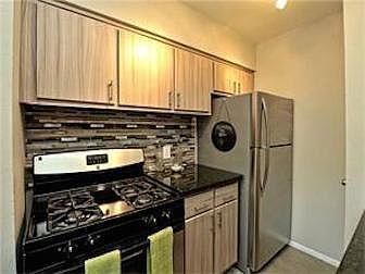 Kitchen with Granite Counter Tops and All New Appliances