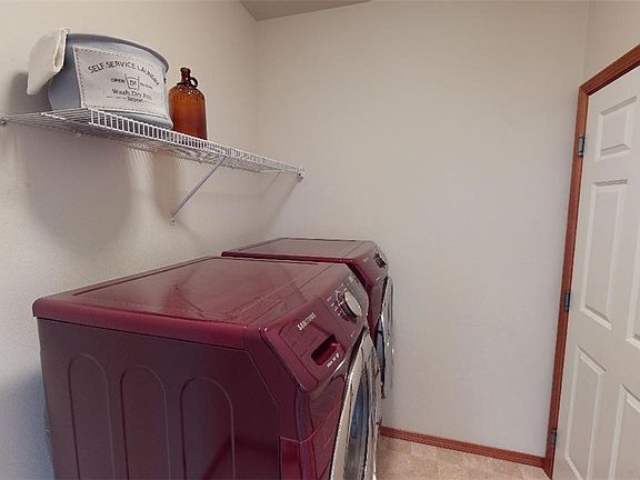 Large Laundry/Mud Room next to the front entry (and this door leads to the Garage). Carry those groceries straight from the car through here and in to the Kitchen.