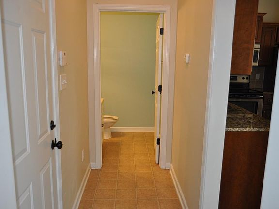 Hall way to half bathroom