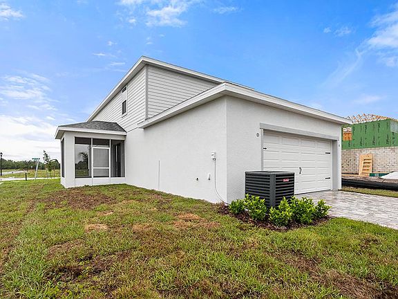 This home includes a rear-entry 2-car garage with a paver driveway.