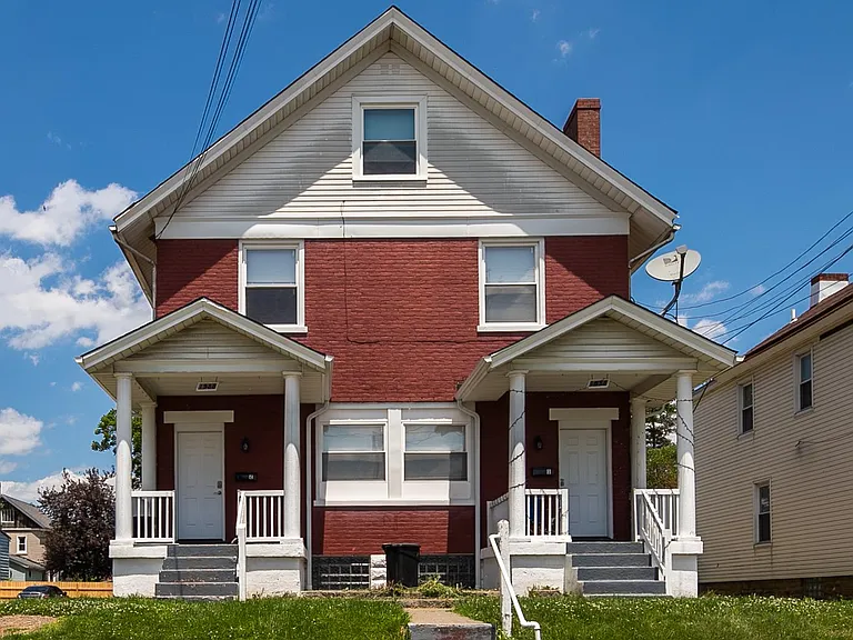 Front exterior. Apartment entrance is off the right porch and unit spans the entire first floor