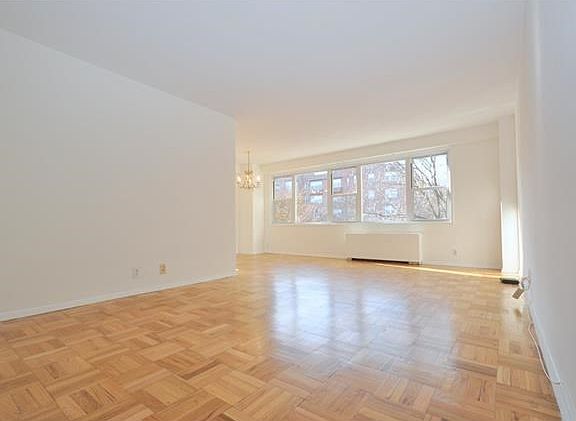 Bright and sunny foyer, living room and dining area have refinished parquet floors and overlooks tree lined Garth Road.  There is a door that leads to a private screened in balcony with Southern exposures.  The living roo is 20'-1" x 12'-0" the dining are