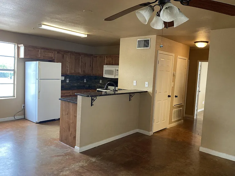 Kitchen/bar, Dining area to the left, hallway with W/D and A/C closets