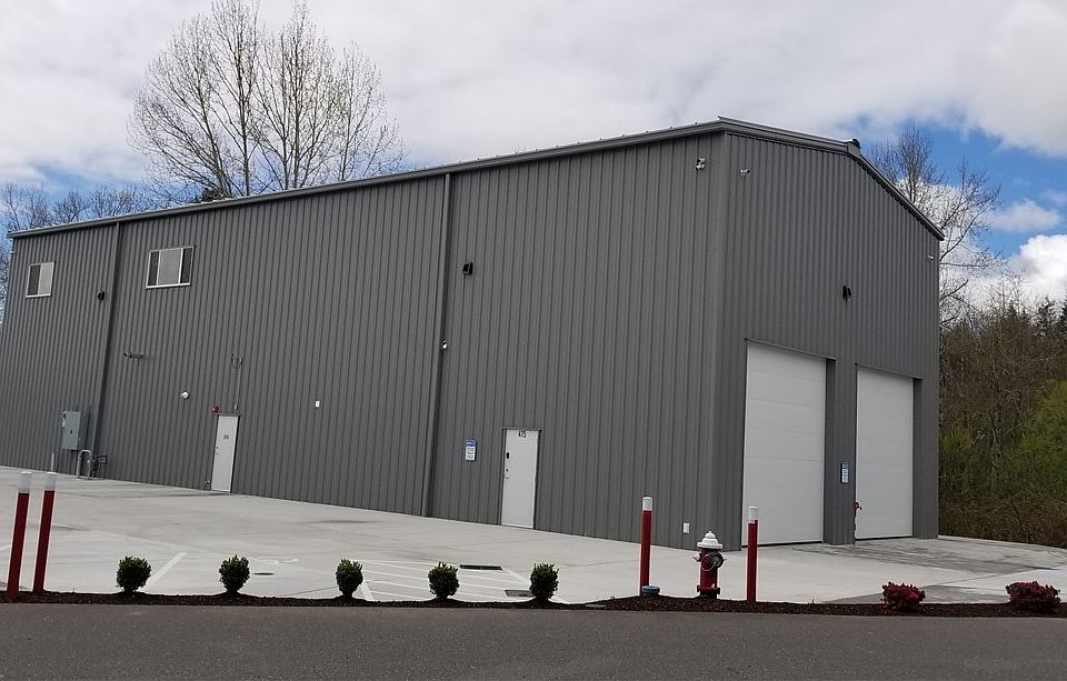 South East side of building from Bakerview Spur.  Two 14' X 14' powered roll up doors on east side. 