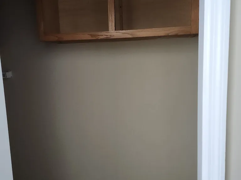 Washer/Dryer Area located to the right and left with cabinets above each appliance. See pantry or shelf for your use. You must furnish these appliances (if desired)