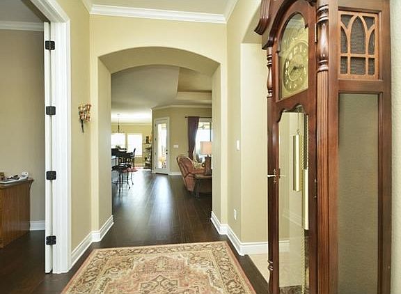 Wood floors greet you at the Foyer, where French door open into the Study/Computer Room, which would