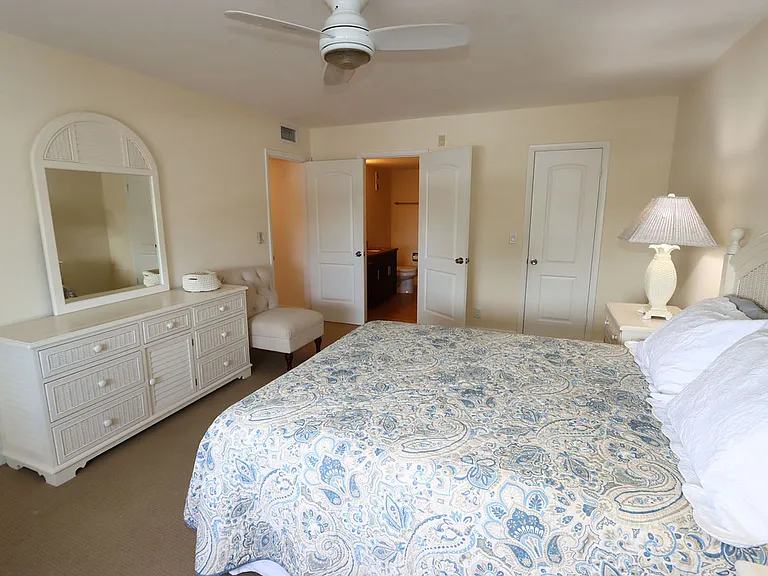 Bedroom with open door to closet