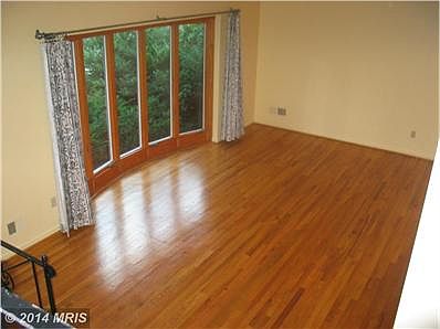 Large bay window-wood floor-vaulted ceiling