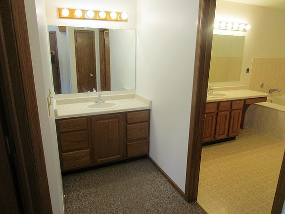 Master bedroom outside sink and entrance to master bathroom
