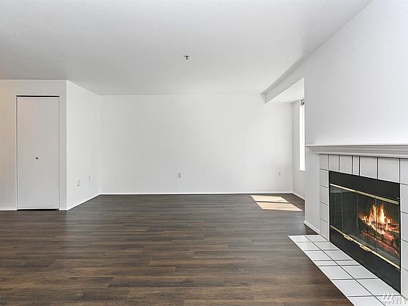 The living room has plenty of space for all of your furniture.