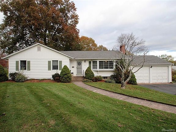 Vinyl siding and large two car garage