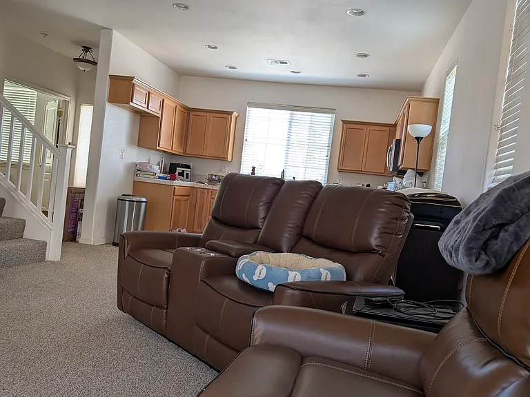 View is from living room looking at kitchen. Floors are now wood look brown tile.