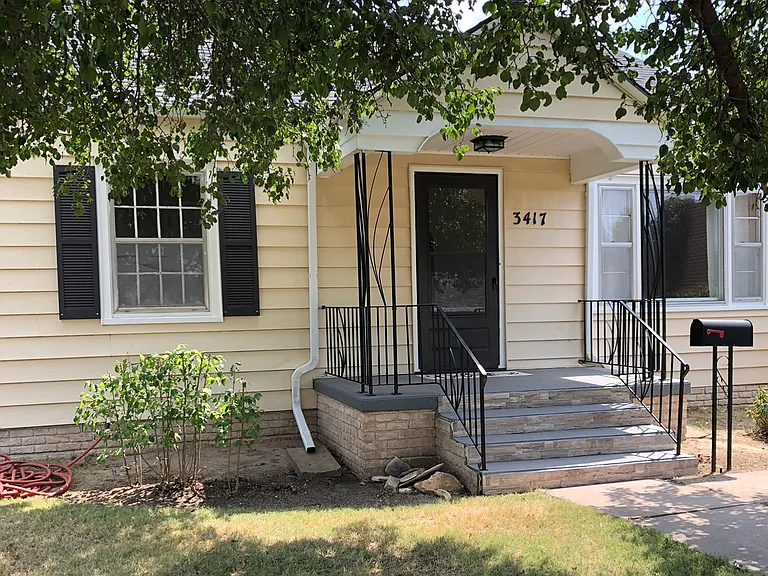 Front porch with large shade trees