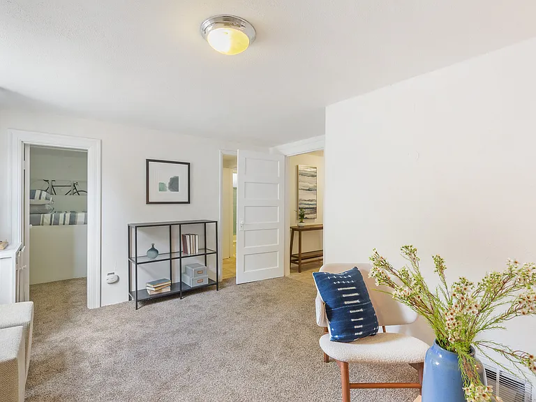 Downstairs living area shown furnished by previous tenant