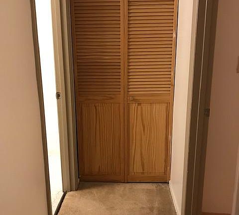 Hallway between bedroom and bathroom.