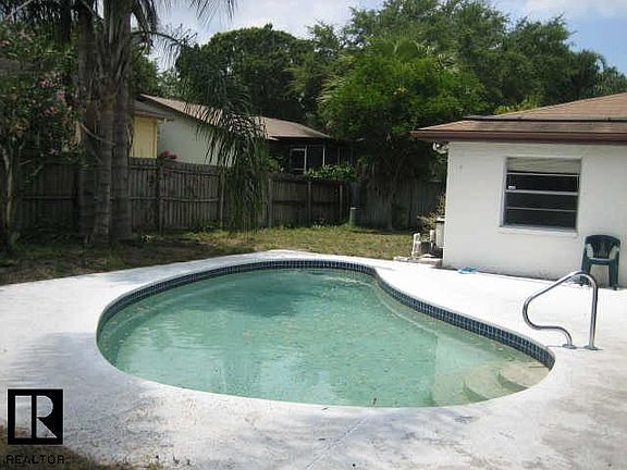 The in-ground pool is in great condition and is part of a large private back y