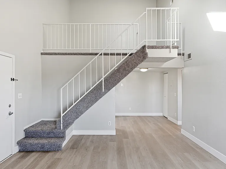 Expansive living room spaces equipped with unique loft space.