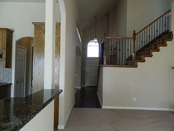 Upgraded wood entry and iron spindles on the staircase, all new carpet downstairs