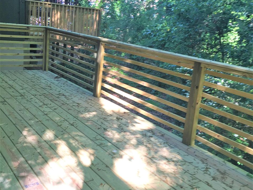 Deck on ground level, surrounded by trees