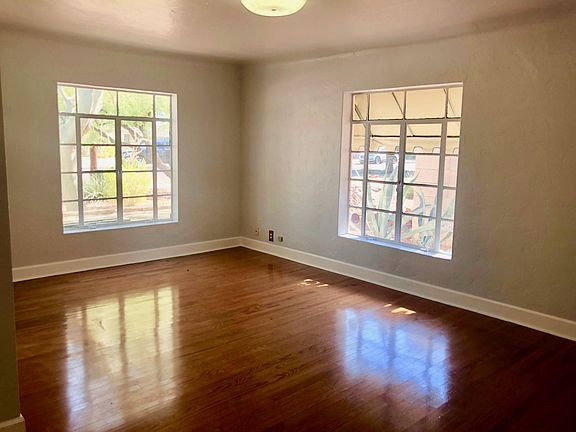 Living room with big windows. Awnings on all to keep house cool