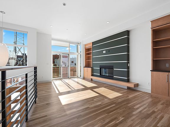 living area, fireplace, balcony