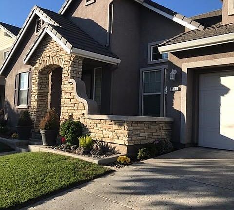 Relax on this charming front porch...