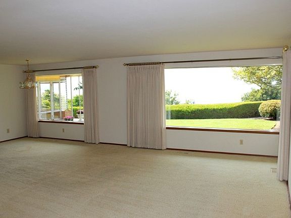 The living room features 2 large windows that give you a fabulous view of the sound & mountains.