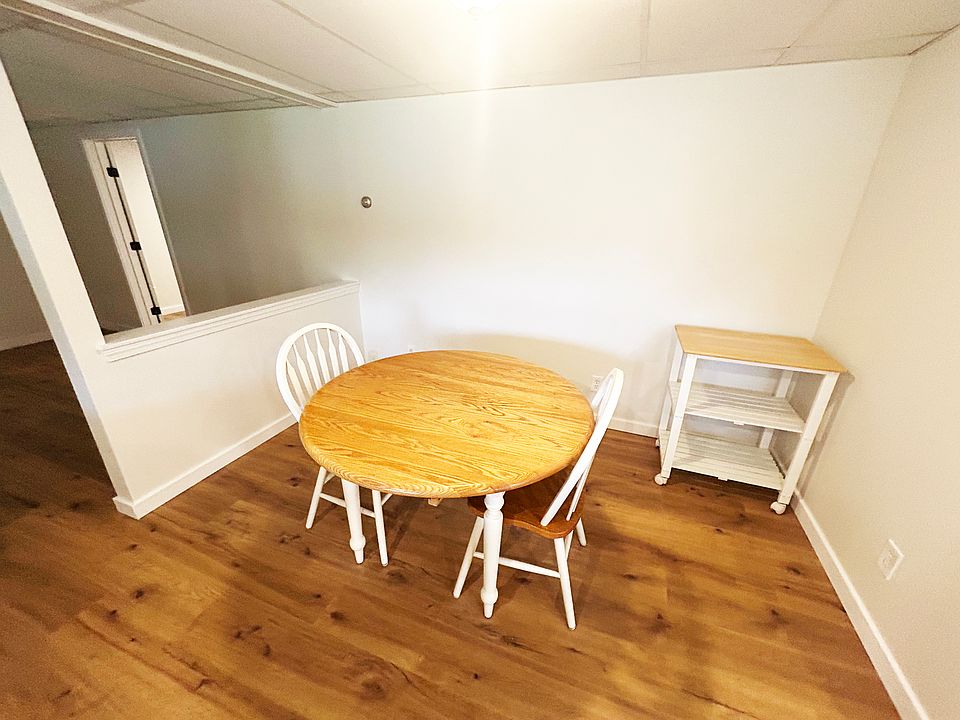 Dining area with half-wall. (Living room on other side of wall.)