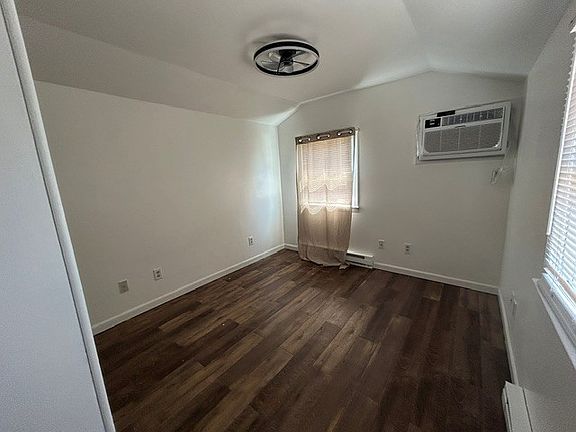 Bedroom w. remote controlled fandelier and new efficient Wall A/C unit