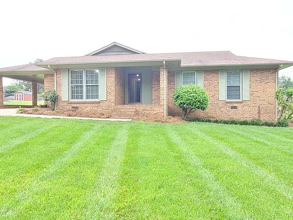 View from Queensberry road. Home along with a car port