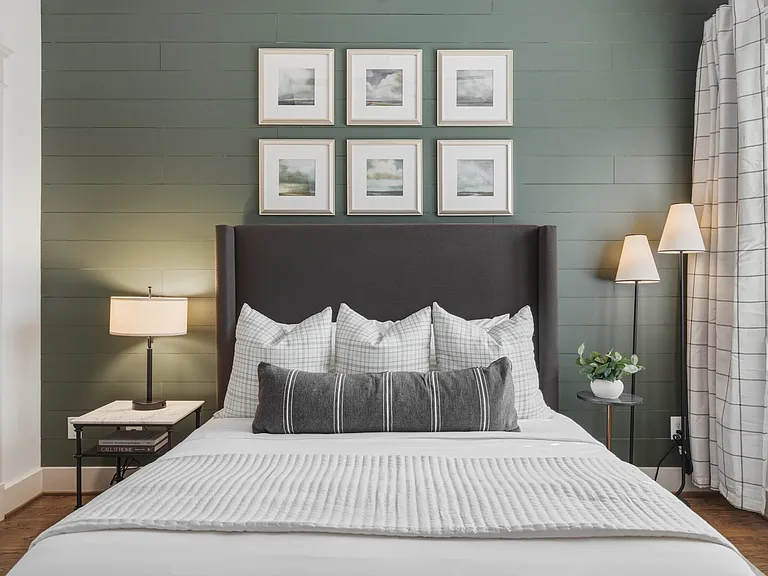 Find a comfortable queen bed in bedroom 3, along with a walk-in closet, dresser, smart TV, and ceiling fan.