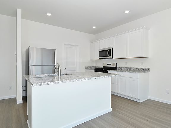 A spacious breakfast bar makes the perfect spot for a quick meal.