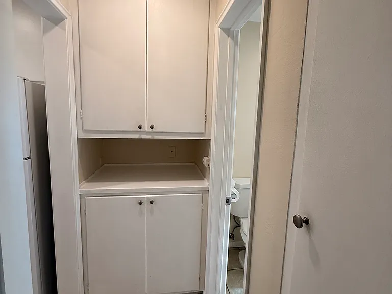 Hallway linen cabinet for extra storage.