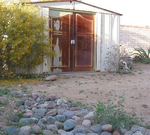 Tool shed and river rock