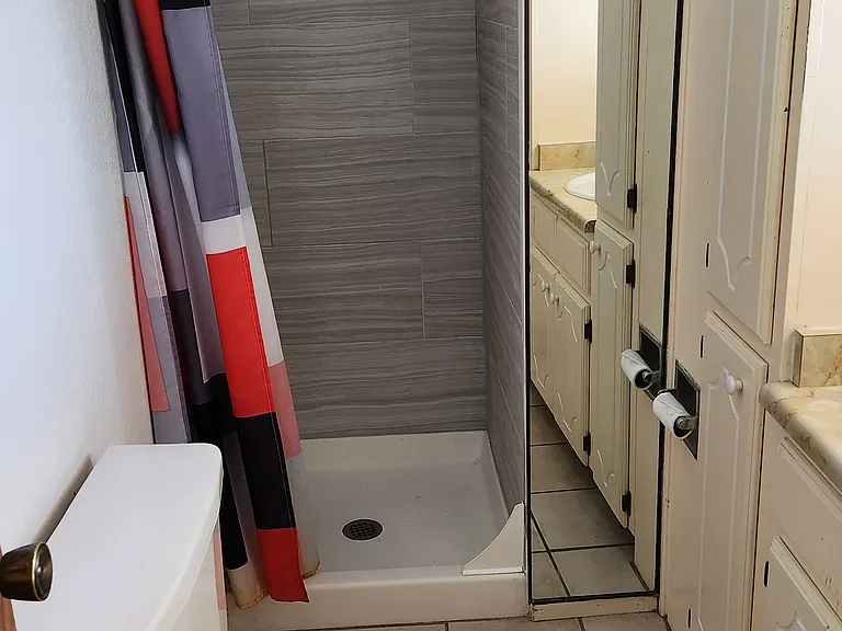 Primary bedroom tiled bath
