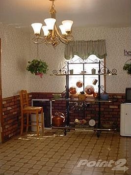 DINETTE AREA WITH PATIO DOORS TO DECK