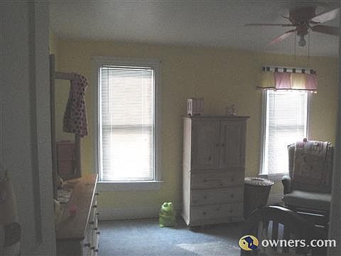 A view of yellow bedroom on right side