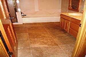 New mocha travertine floors in the bathrooms and entry