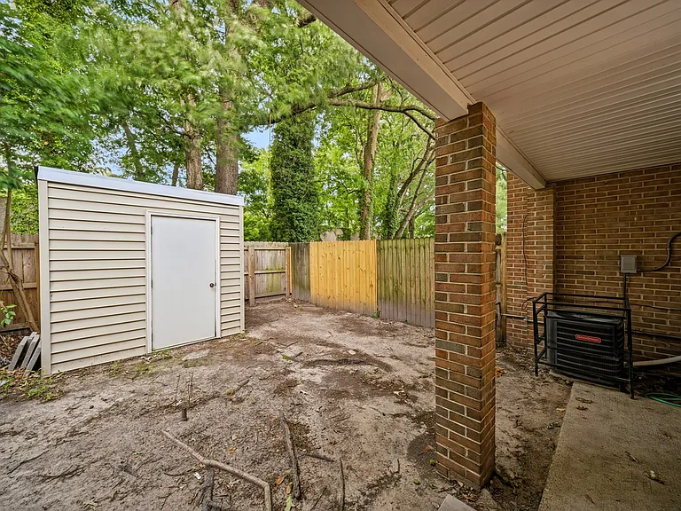 Covered backyard porch and yard area