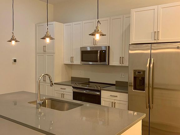 Kitchen viewed from one side of the living room