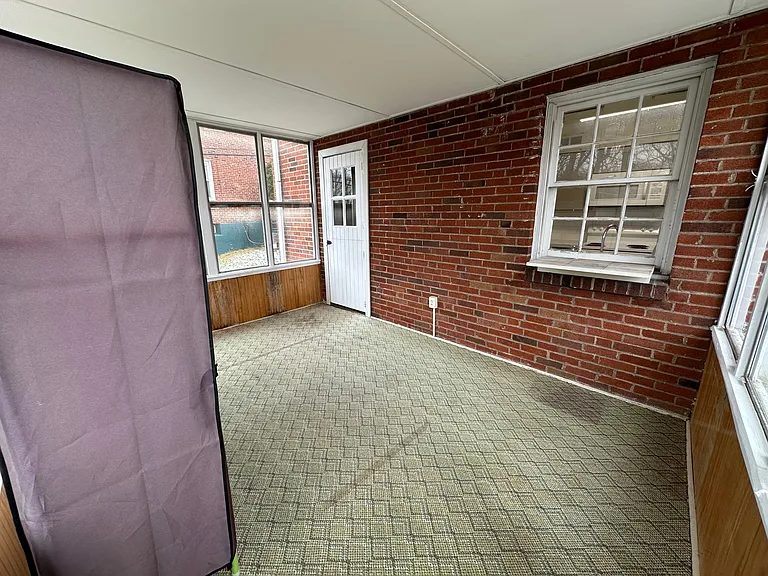 Enclosed porch off the dining room.