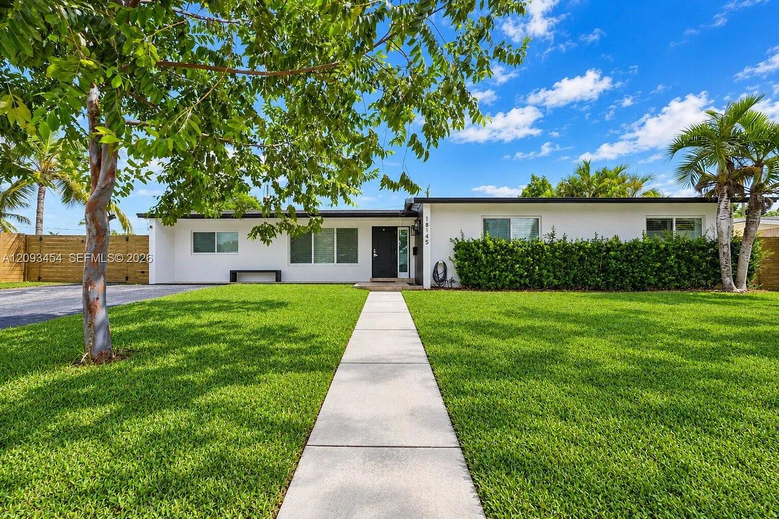 Enjoy your own private tropical retreat in this beautifully upgraded 4-bedroom, 2-bath pool home — Photo 1