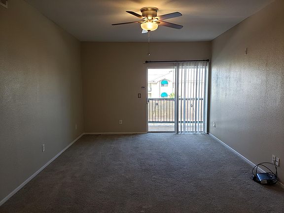 Spacious living room with balcony access.