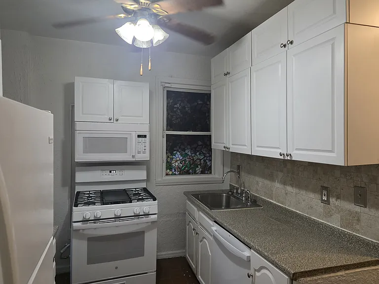 The Kitchen: Microwave, and brand new stove and dishwasher.