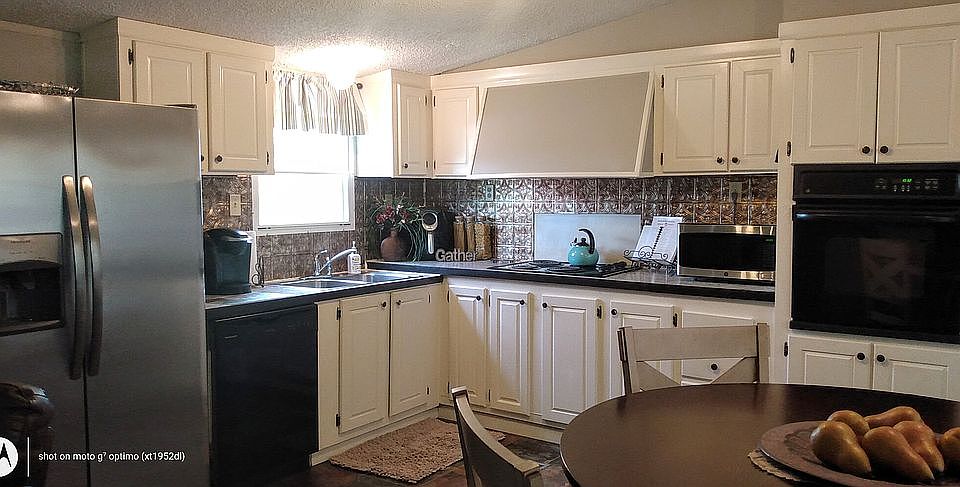Large open kitchen with dining
