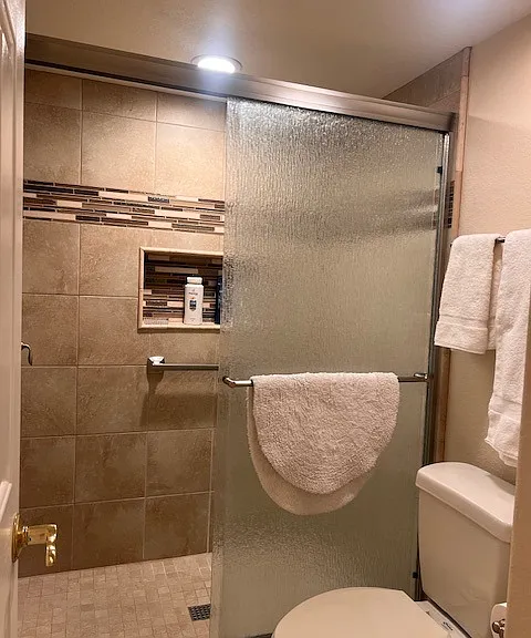 Primary shower with designer tile.