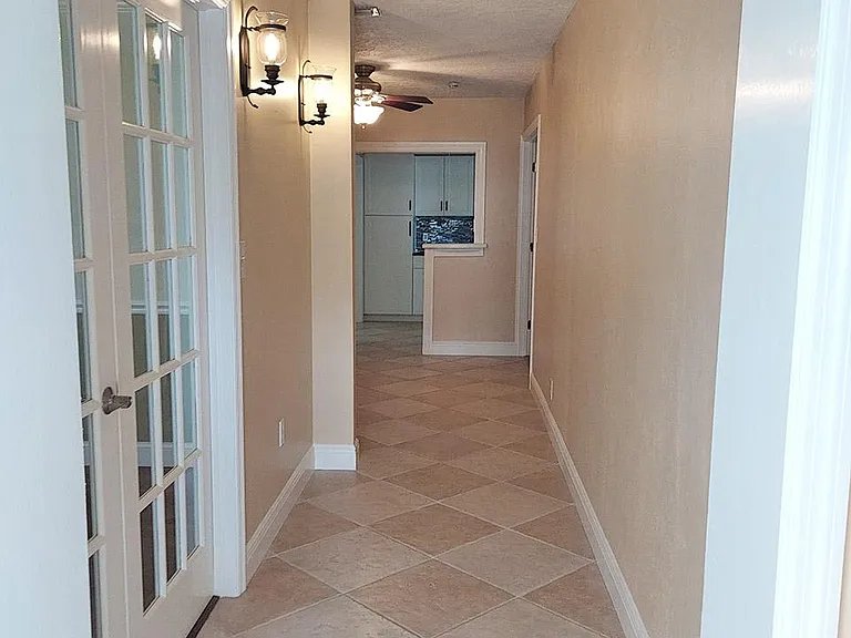 Main Entry Hallway - Bedroom 3/Home Office to left.
Bonus Room/Library/Sitting Room Ahead. Kitchen ahead. Master Bedroom ahead to right.