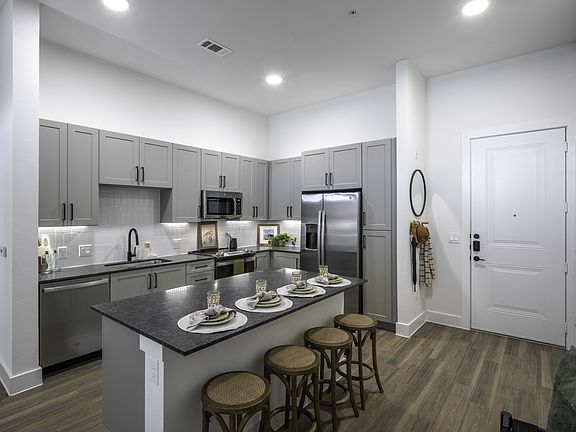 Modera Walsh's kitchens, feature luxurious granite countertops for timeless sophistication.