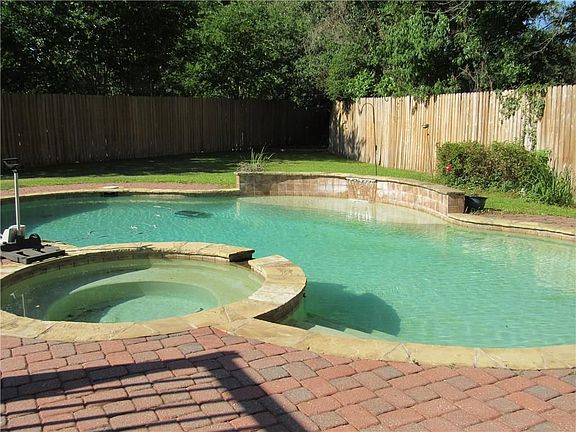 Being on a cul-de-sac, the back yard is wide, has lots of privacy, and plenty of space for backyard activities, including the gunite pool.  There's a delightful patio overlooking the pool and spa, with space for enjoying your morning coffee, intimate sunbathing, or dining alfresco.