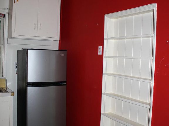 Two built in shelves, new refrigerator, gas stove